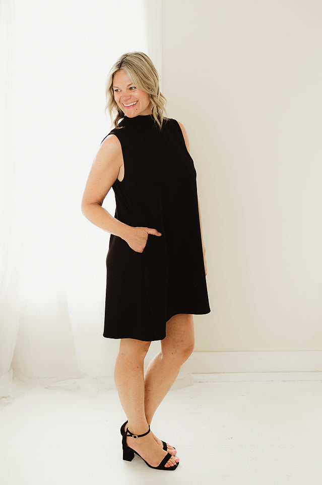black swing dress Mock Neck – Ella Mae's Boutique M Pocketed and pairs well with just about everything Maggie Merino Wool Swing Dress